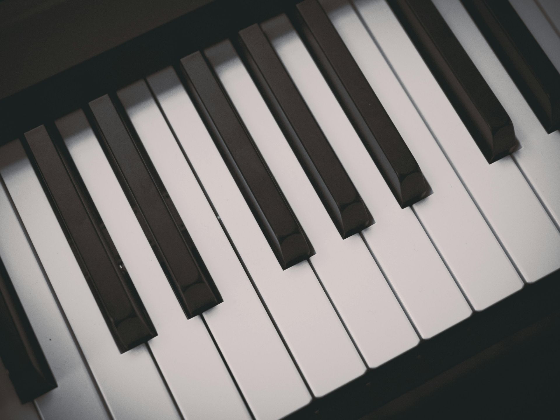 Piano keys, black and white, close-up shot.