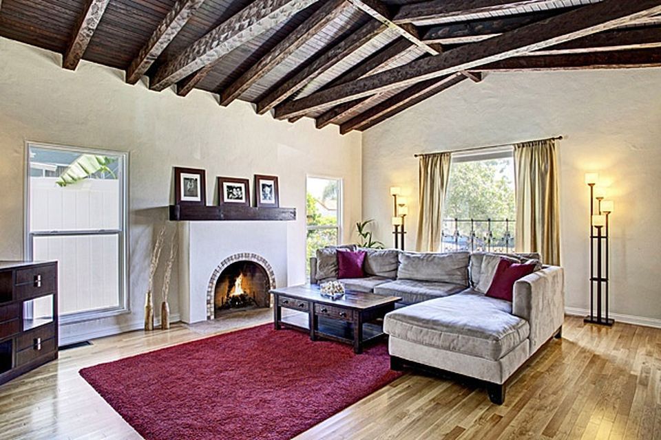 A living room with a fireplace and a couch