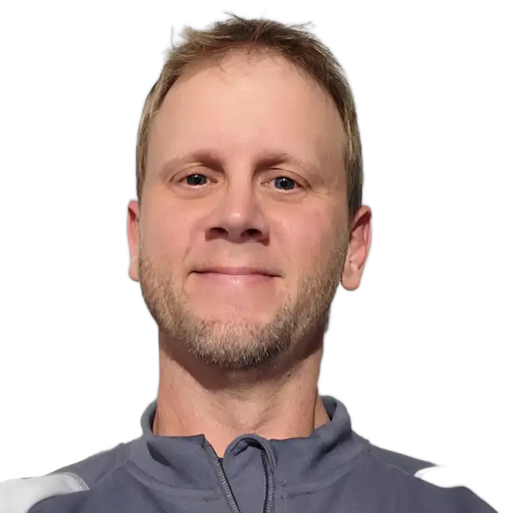 Portrait of a smiling man in a gray jacket against a white background
