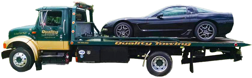Quality Towing truck Fayetteville NC. A black car is on the back of a tow truck