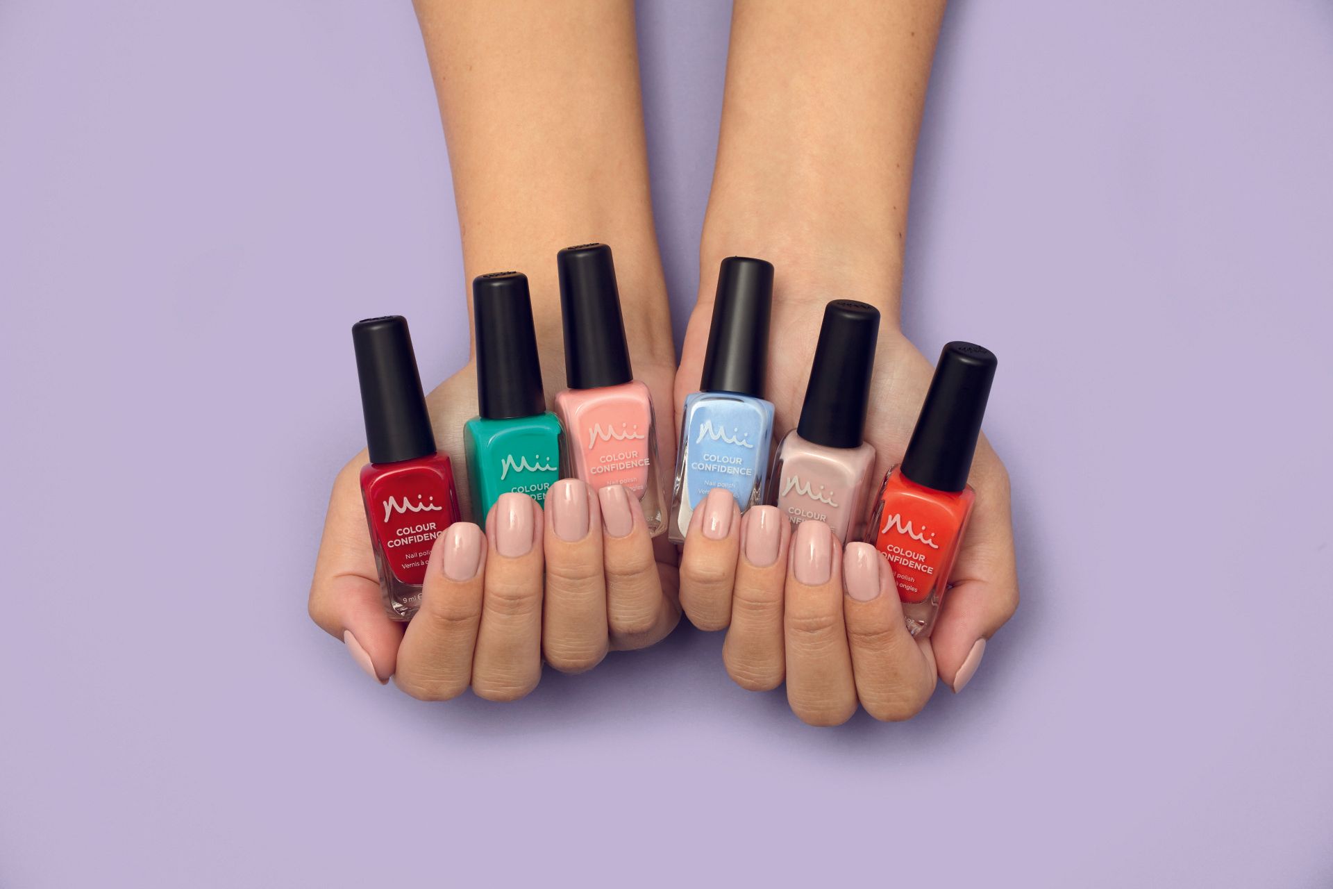 hands and feet with red nail polish