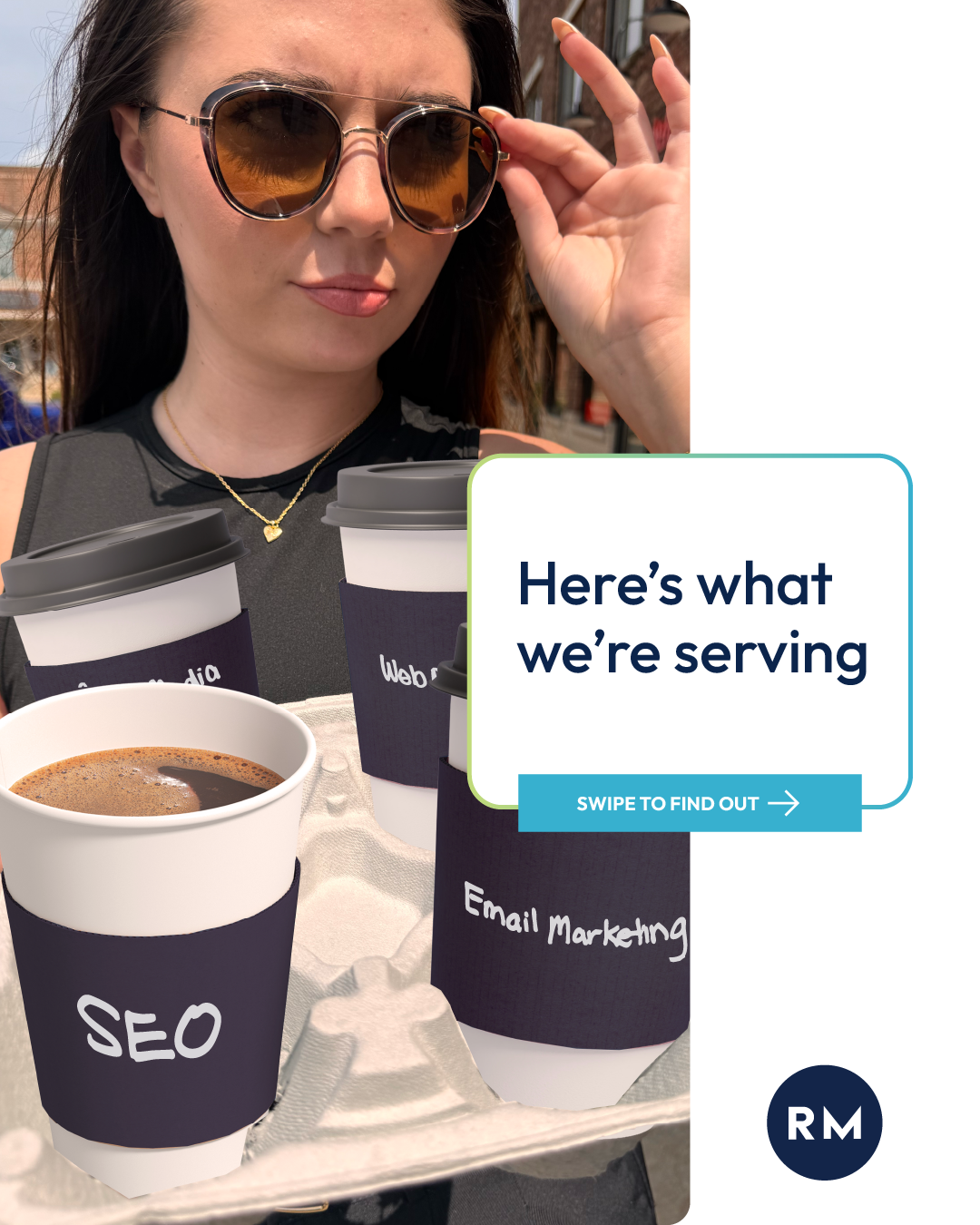 A woman wearing sunglasses is holding a tray of coffee cups.