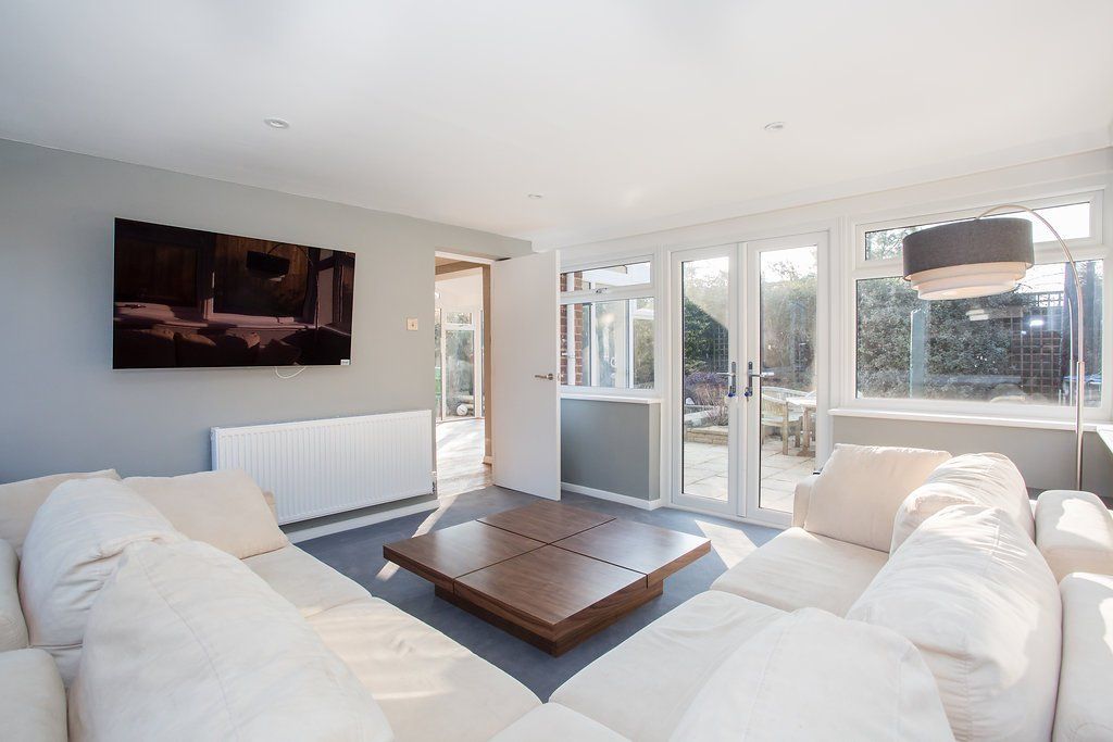 Modern lounge area in glass extension