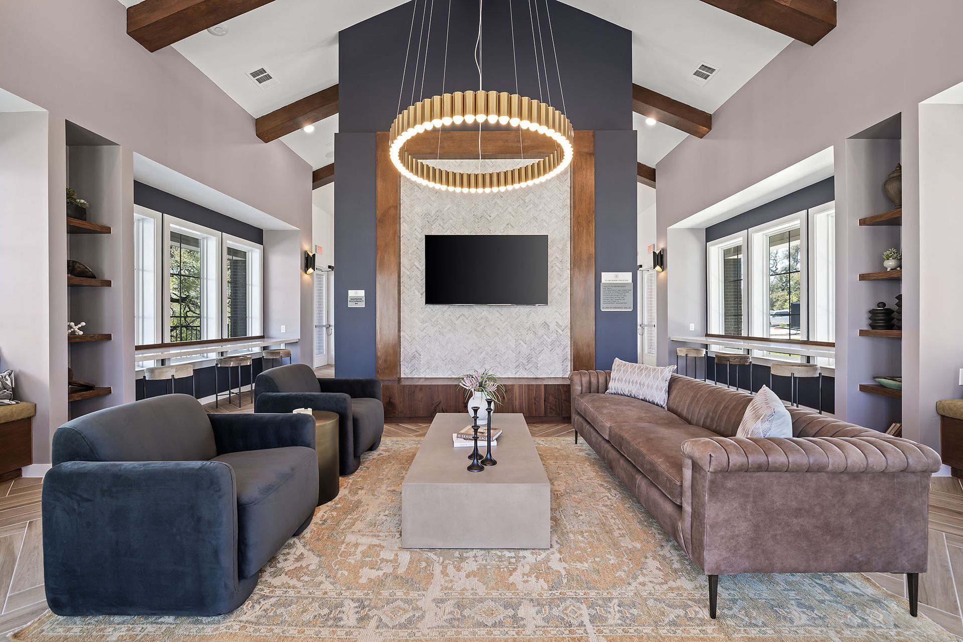 Clubhouse filled with furniture and a flat screen tv at The Everett, offering North Austin apartments for rent.