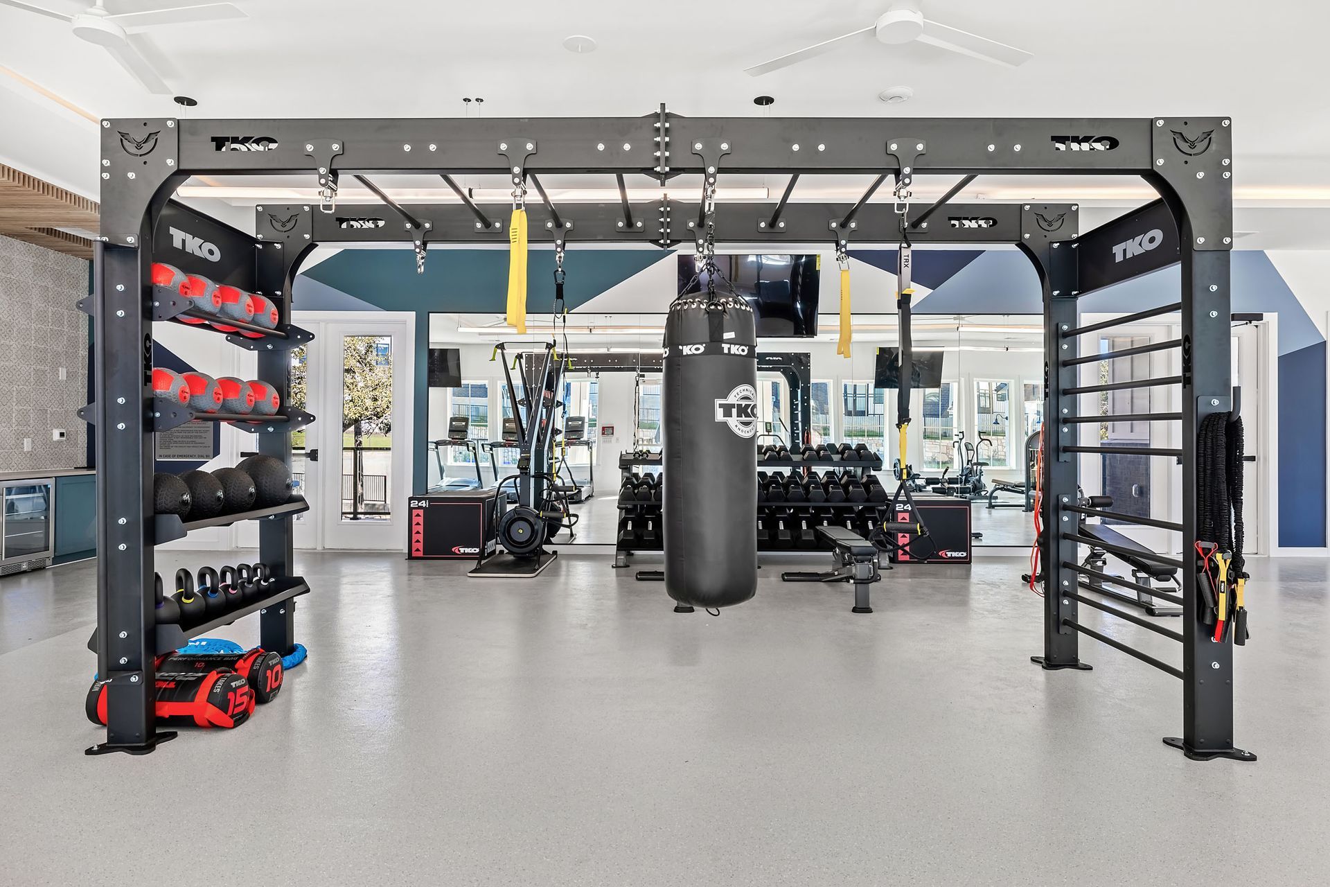 A large gym with a boxing bag hanging from the ceiling at The Everett. offering apartments in Northwest Austin, TX.