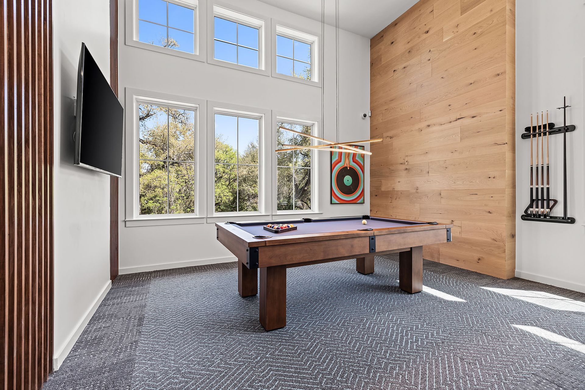 There is a pool table in the middle of the game room at The Everett, offering apartments for rent in Austin, TX.
