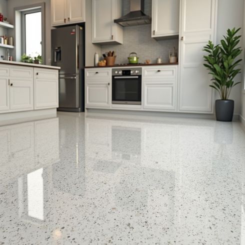 Kitchen with shiny, speckled, light-colored floor, white cabinets, and a stainless steel refrigerator.