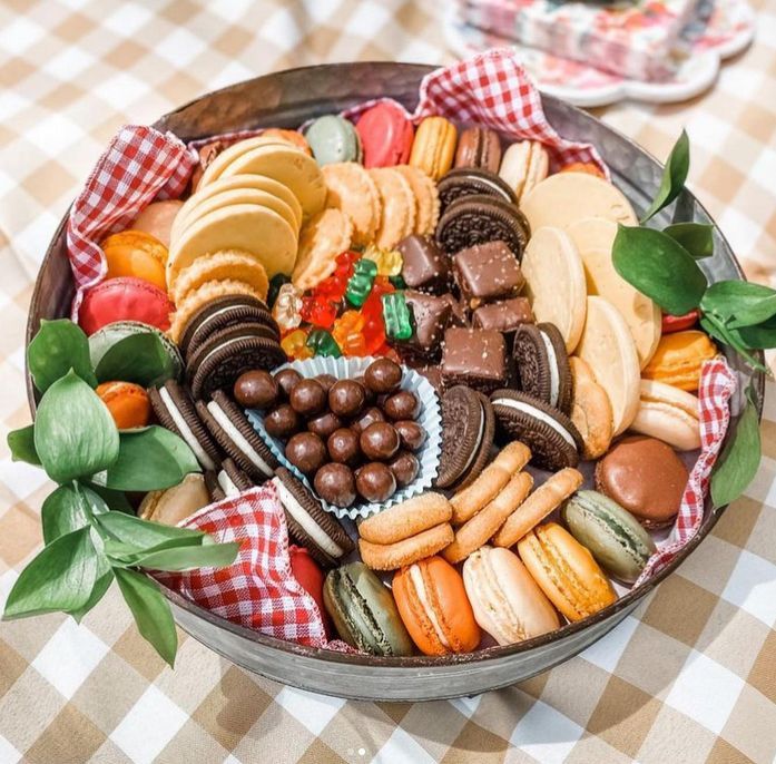 A bowl filled with a variety of cookies and gummy bears