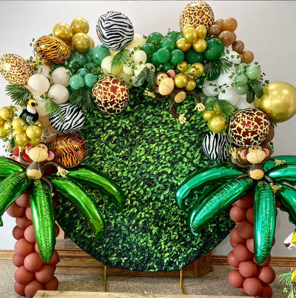 A bunch of balloons with animals on them