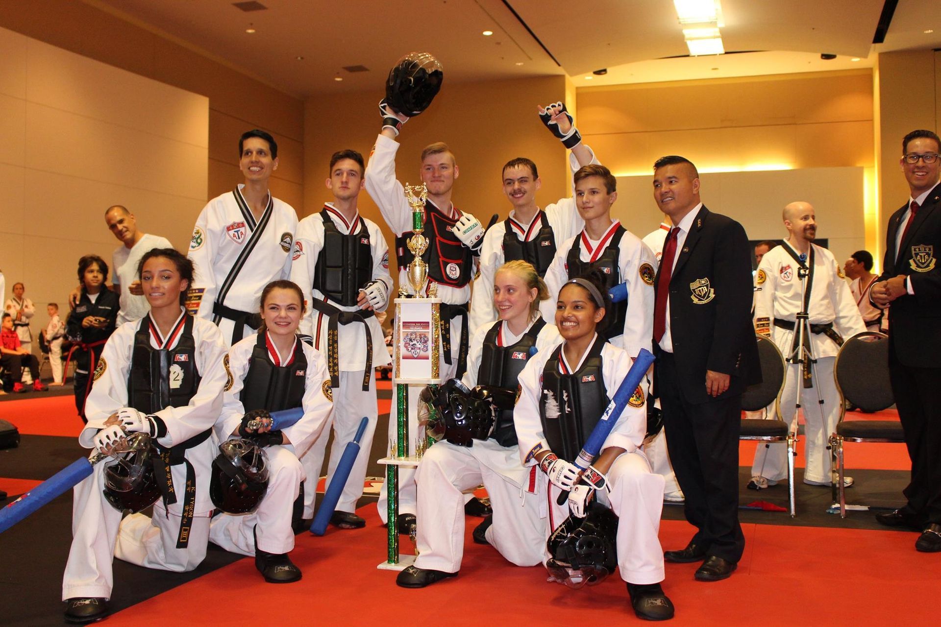 A group of martial arts fighters posing for a picture