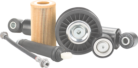 Various car parts, including an air filter, and pulleys, on a white background.