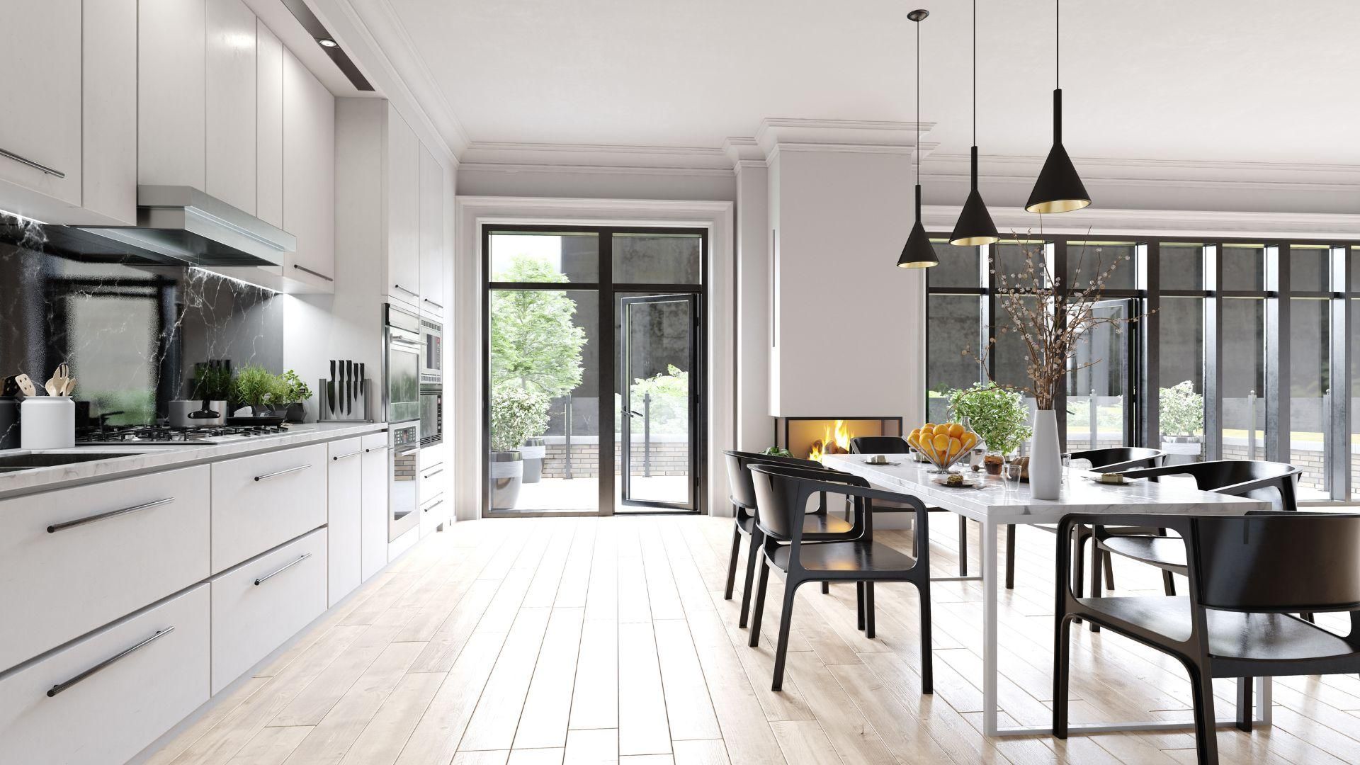 A kitchen and dining room with a long table and chairs.
