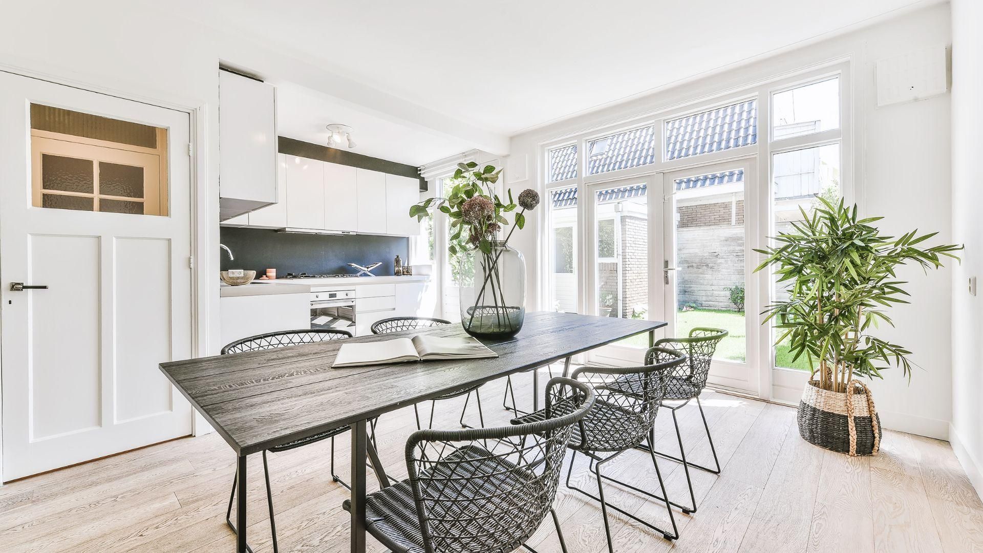 There is a large table and chairs in the dining room.