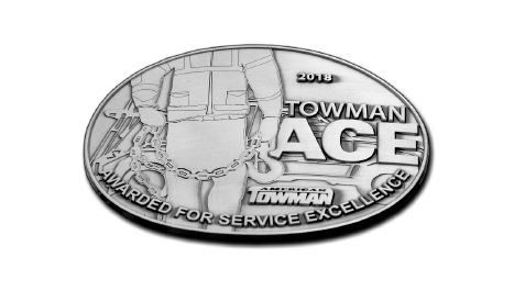 A silver coin that says townman ace on it