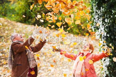 A Man and a Woman Are Throwing Leaves in the Air — Portsmouth, NH — Lager Susan R