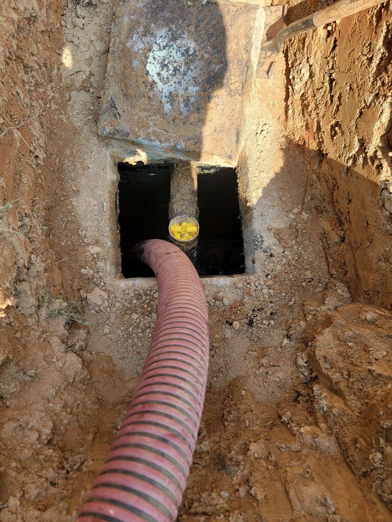 Red Hose Pumping Septic Tank