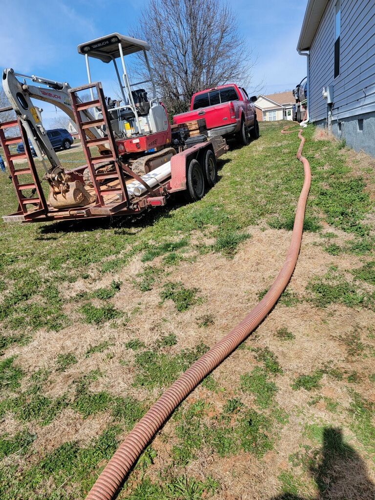 Red Pickup Towing Excavator With Hose