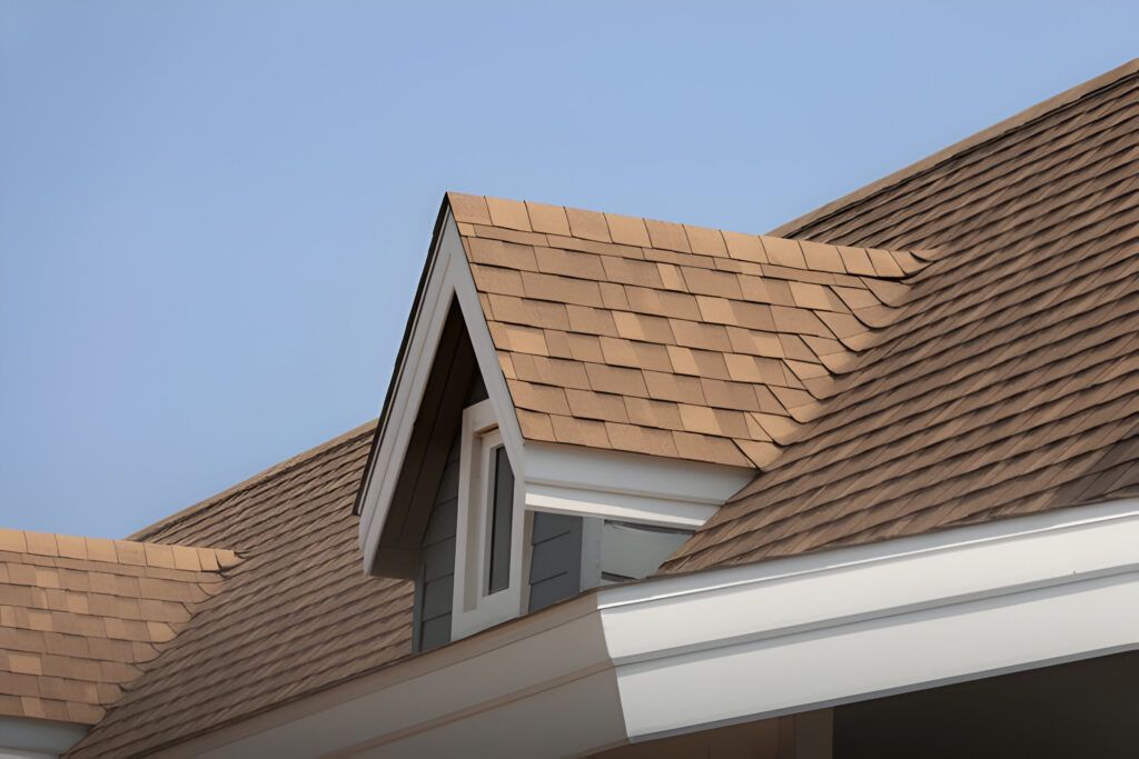 The roof of a house with a window on it.