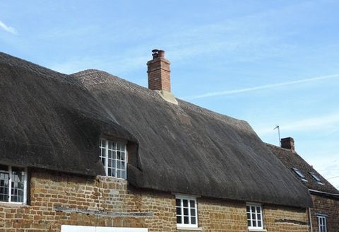 chimney on  thatched roof
