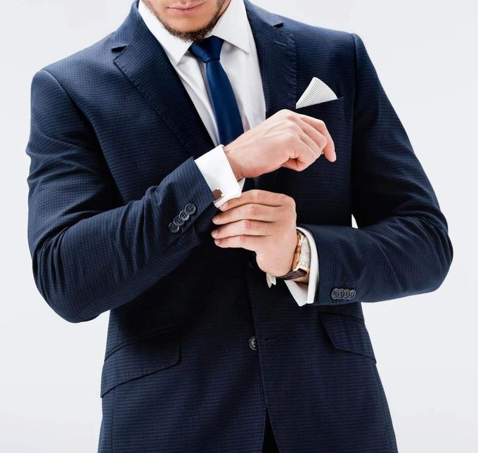 cropped view young businessman suit posing