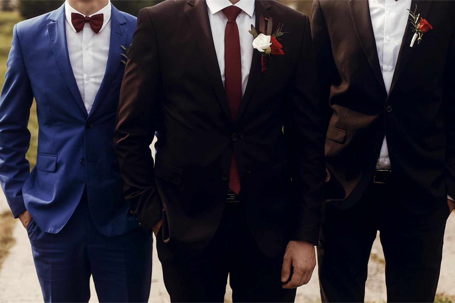 three men in suits and ties are standing next to each other