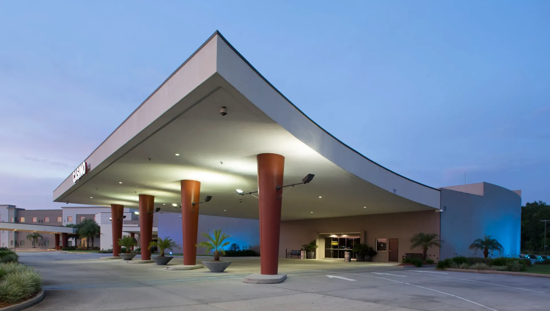A large building with a curved roof and columns