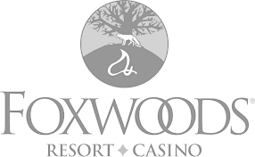 A black and white logo for foxwoods resort and casino.