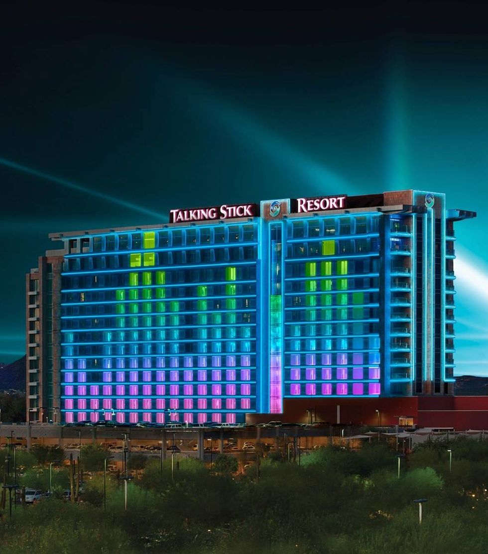 The talking stick resort is lit up at night