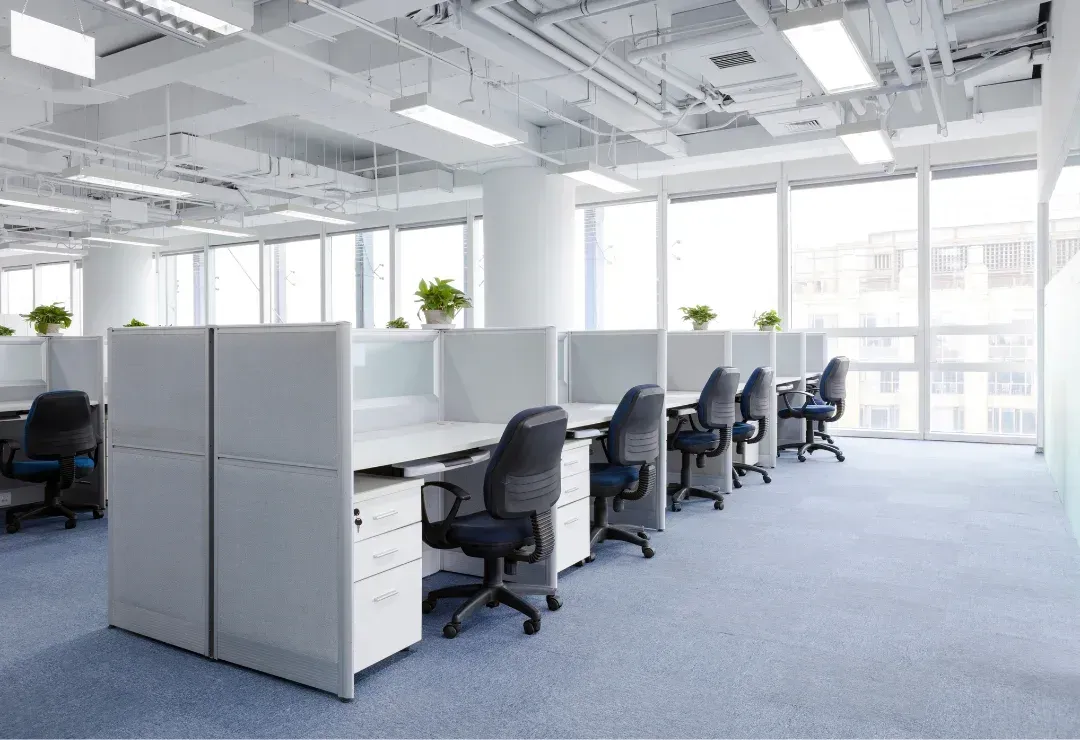 an office with cubicles and chairs