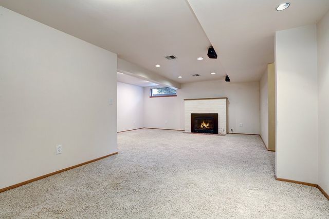 clean and empty house with a chimney