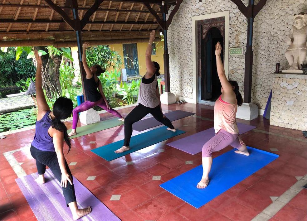 A group of women are practicing yoga in a room