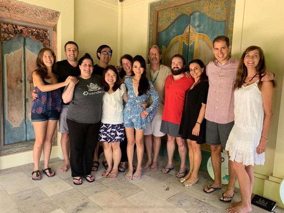 A group of people are posing for a picture together.