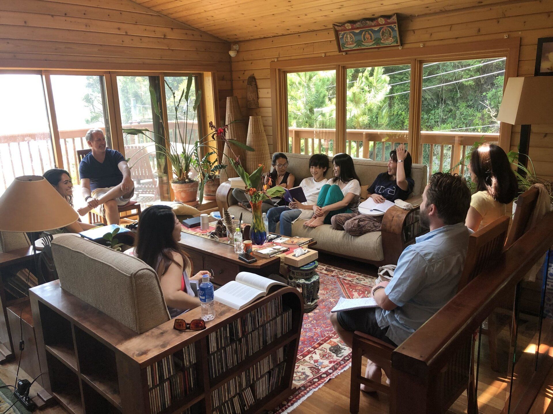 A group of people are sitting in a living room.