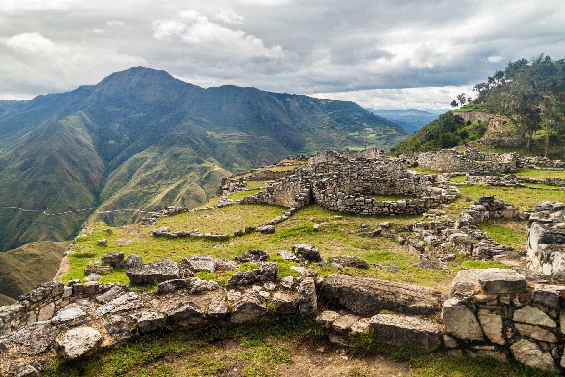 ancient stone ruins, kuelap fortress, peru, green mountains
