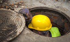 Septic System Inspections — Man Inspecting sewerage in Niwot, CO