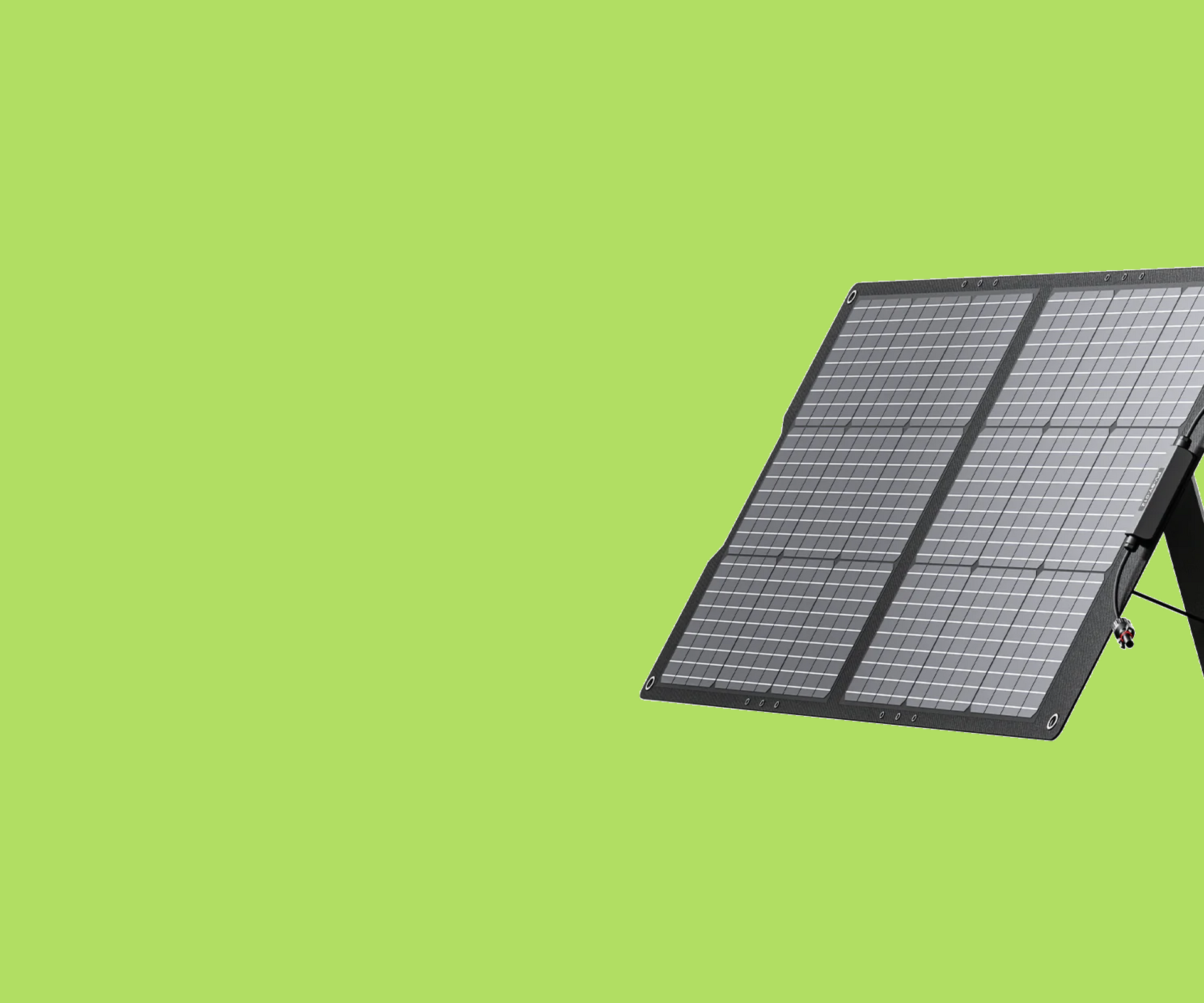 A solar panel is sitting on top of a green surface.