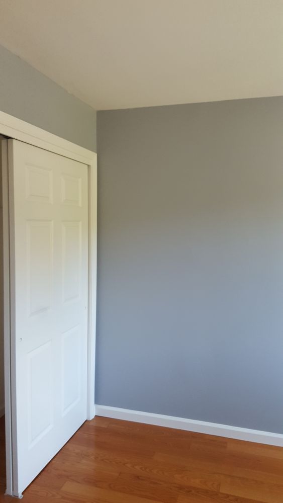 There is a closet in the corner of the room