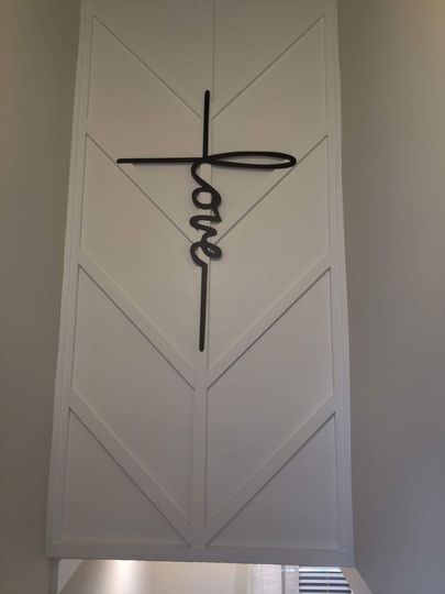 A cross with the word jesus written on it