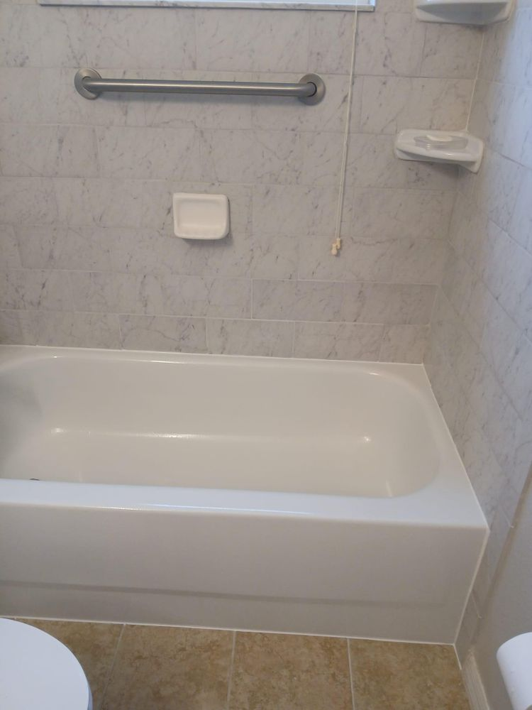 A bathroom with a bathtub and a toilet
