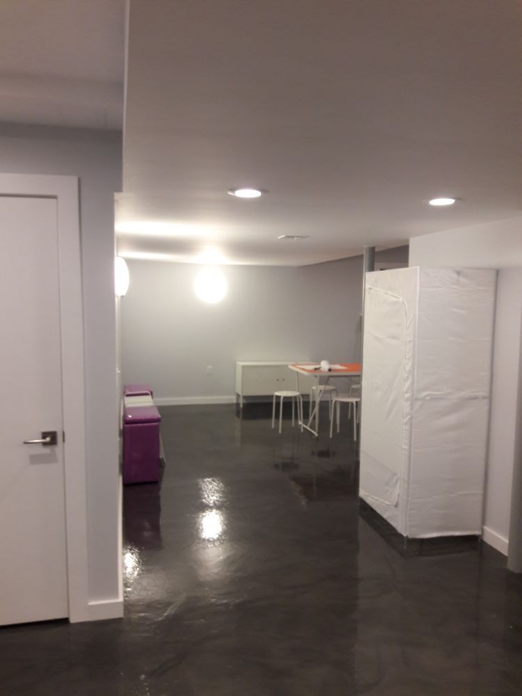 A room with a table and chairs in it