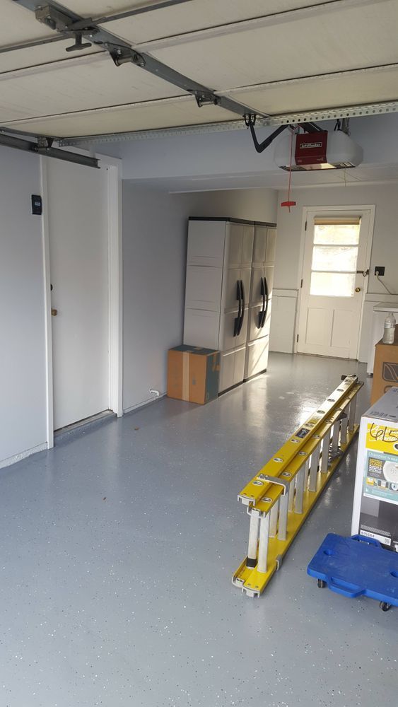 There is a ladder in the middle of the garage.