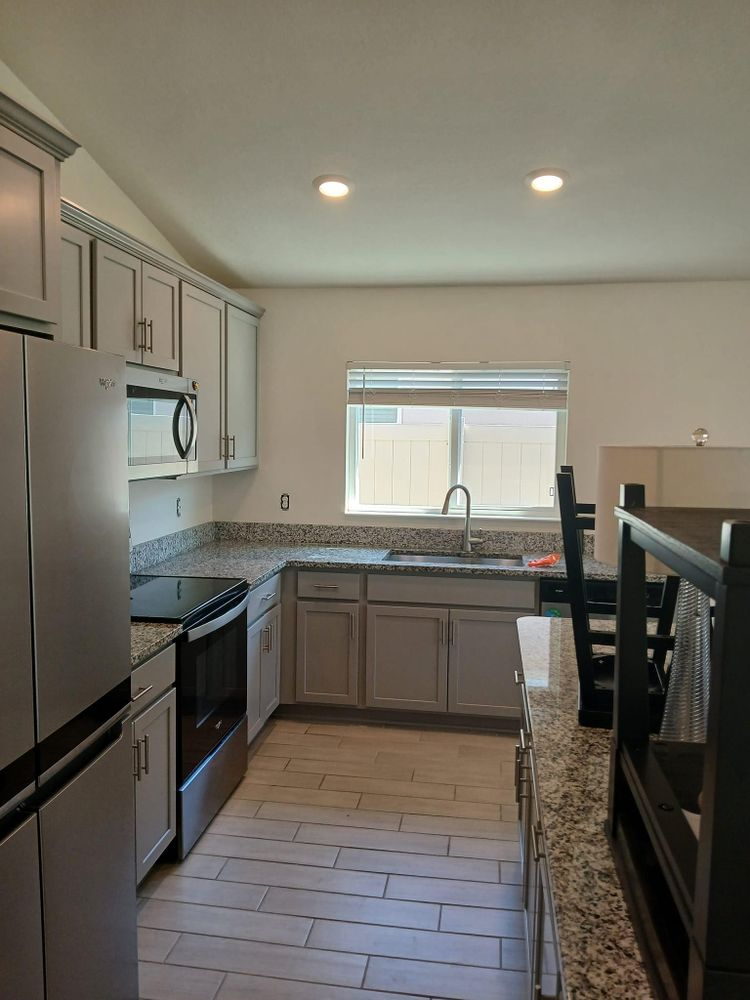 A kitchen with stainless steel appliances and granite counter tops