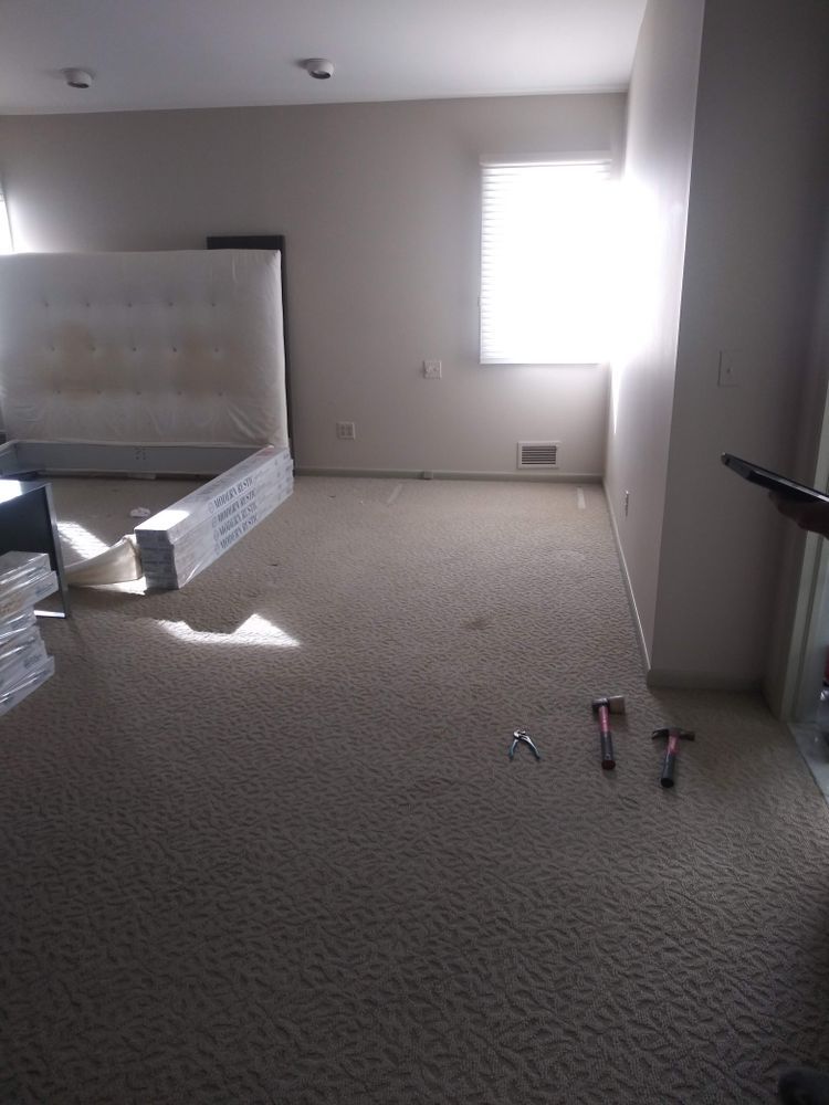 A living room with a couch and a window