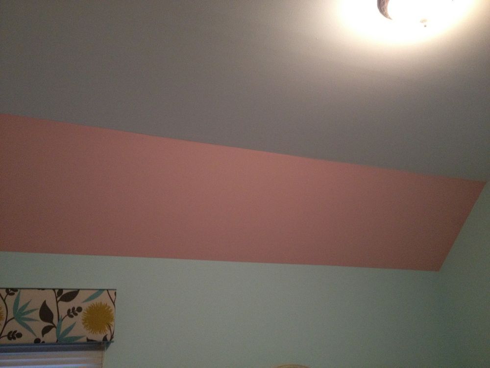 A pink and white ceiling in a room