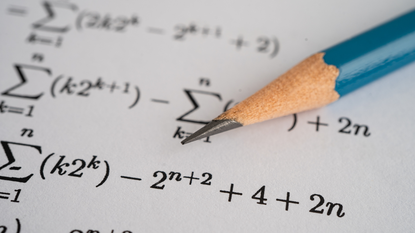 Pencil on paper with complex math equations, including summations, and exponents.