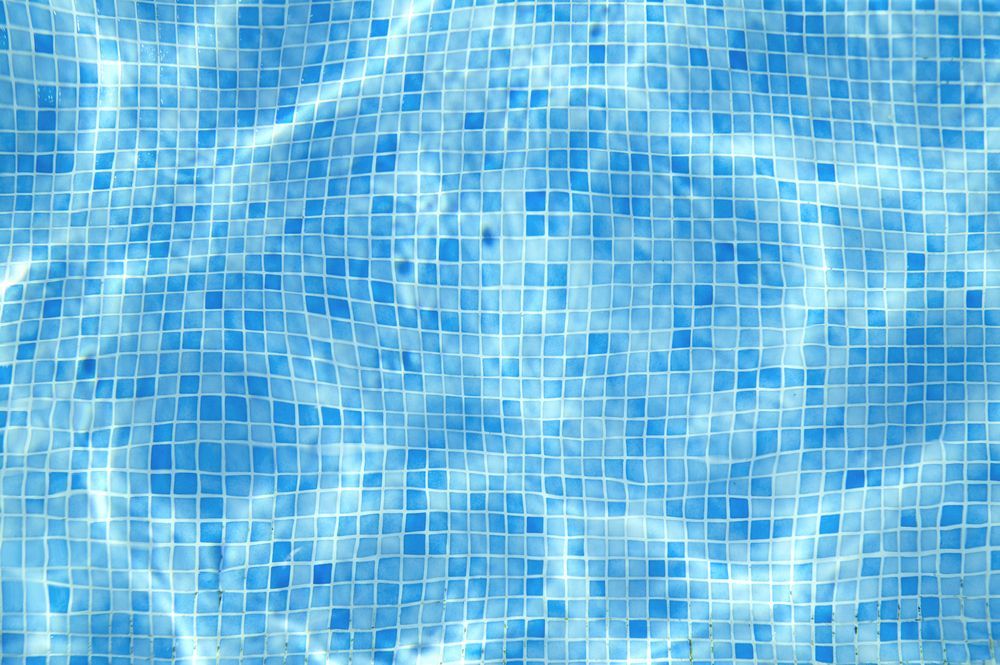 A Close Up Of A Swimming Pool With Blue Tiles And Water — Tile Power Dubbo In Dubbo, NSW