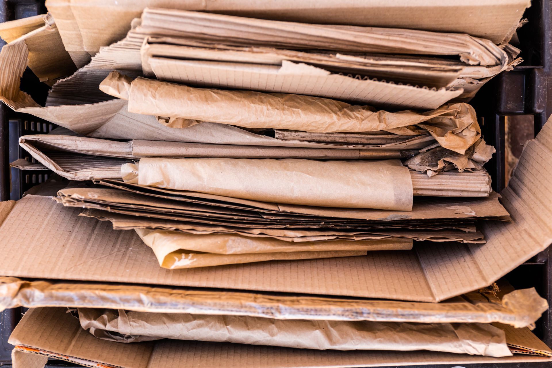 A pile of cardboard boxes stacked on top of each other.