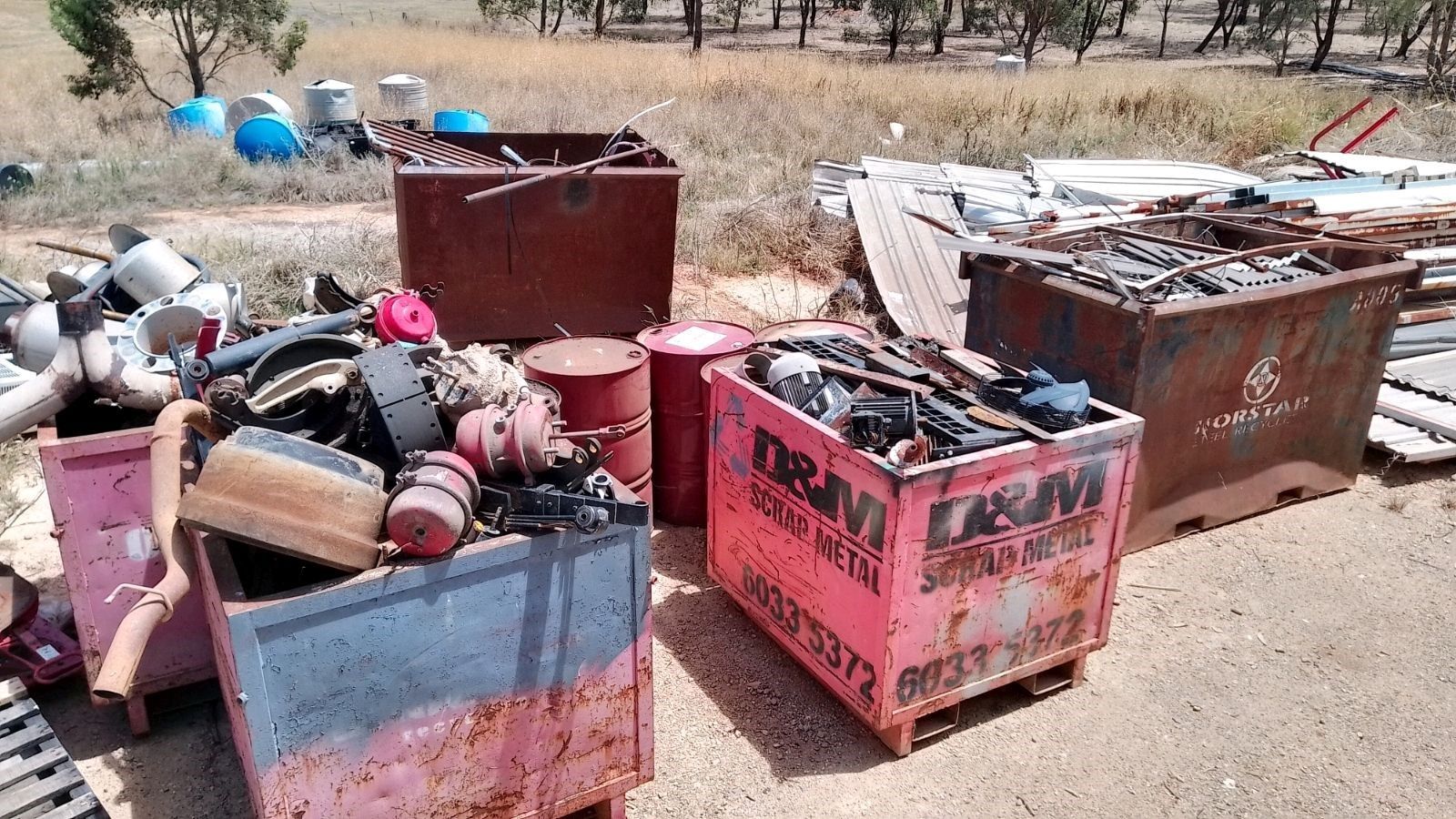 Red metal bins full of scrap metal.