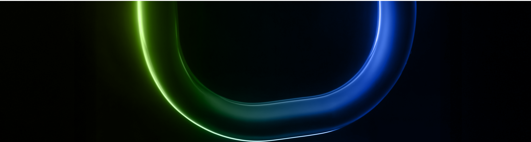 Un'onda luminosa blu e verde su uno sfondo nero.