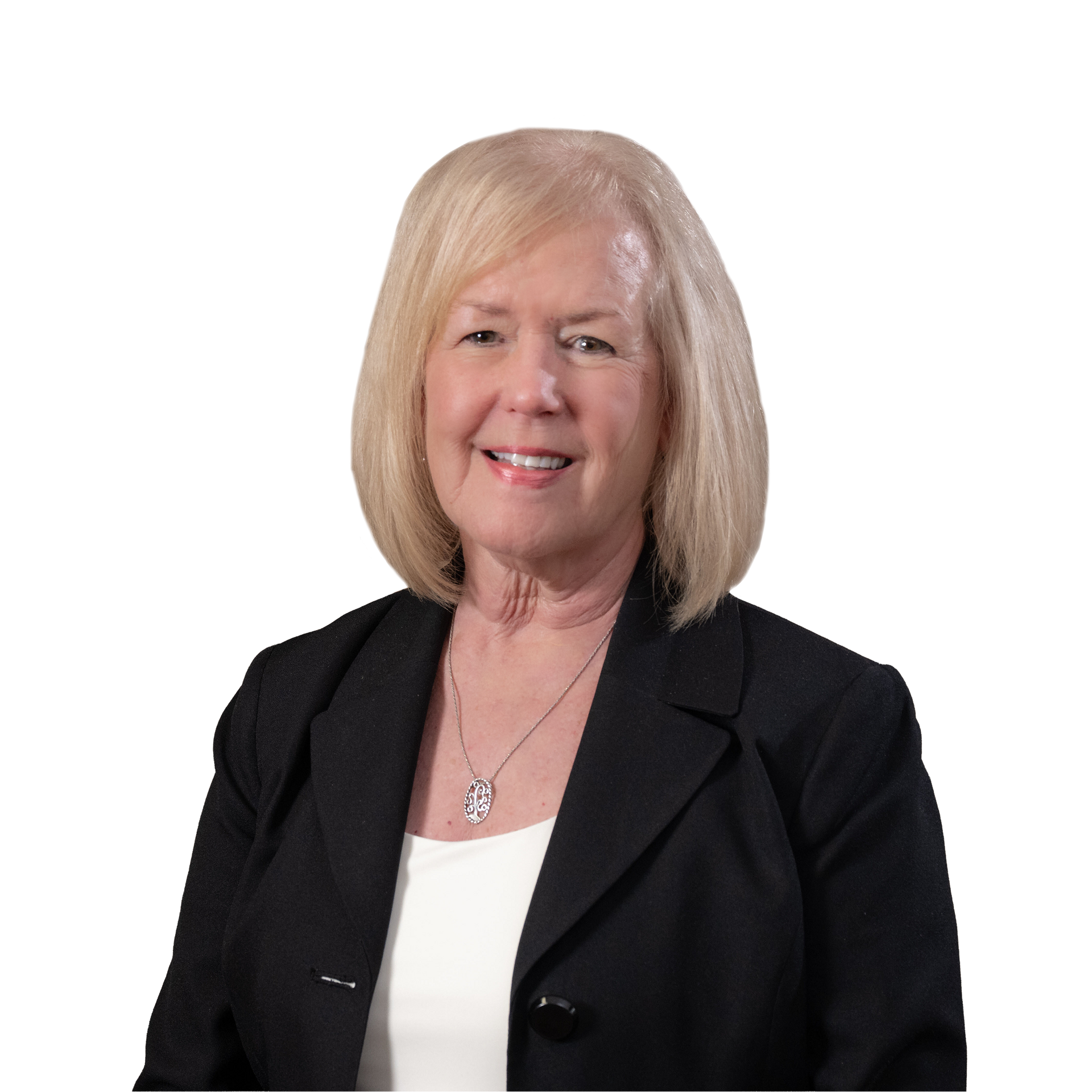 Man in a blue suit, glasses, and a patterned tie, smiling. Studio shot.